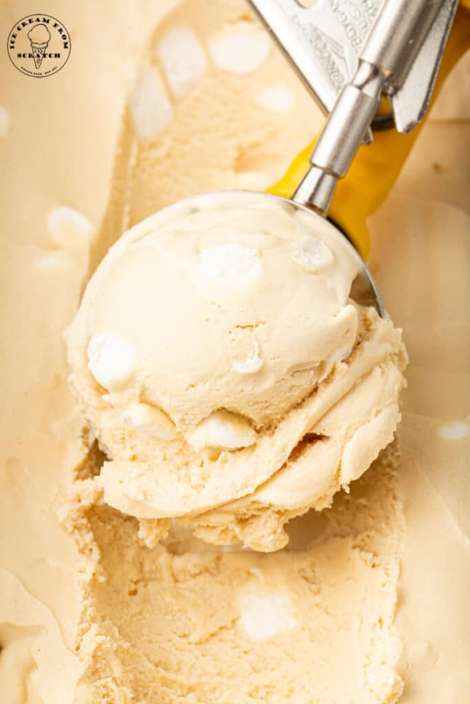 marshmallow ice cream being scooped with a metal ice cream scoop