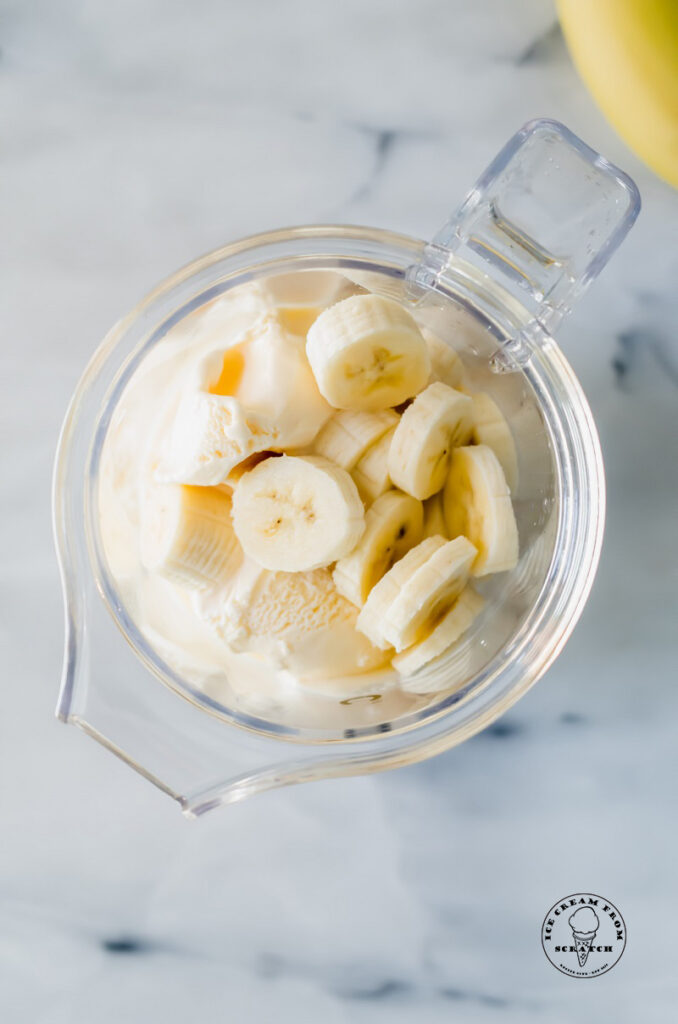 ingredients in banana milkshakes in a blender jar