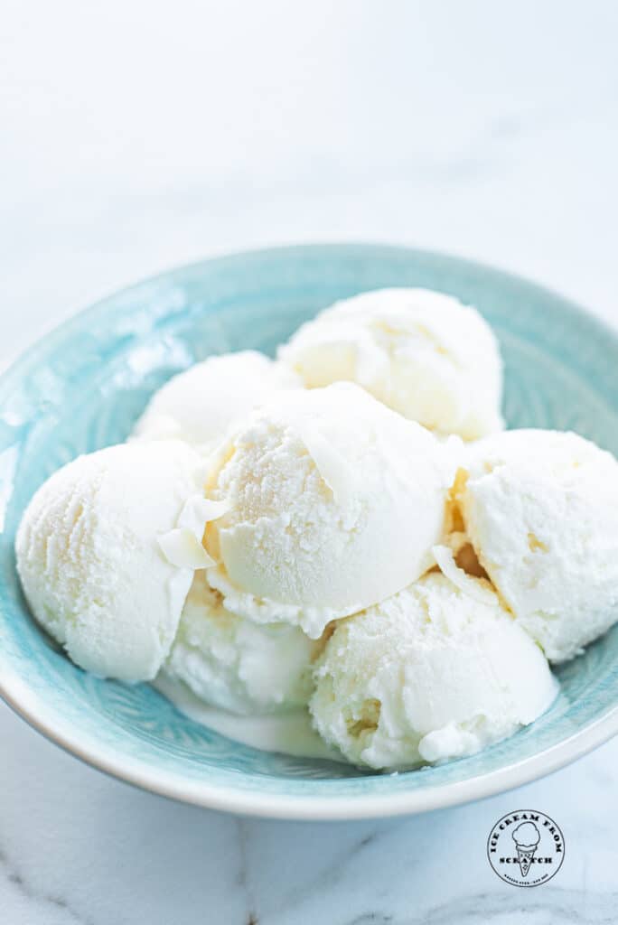 scoops of coconut sorbet in a blue bowl