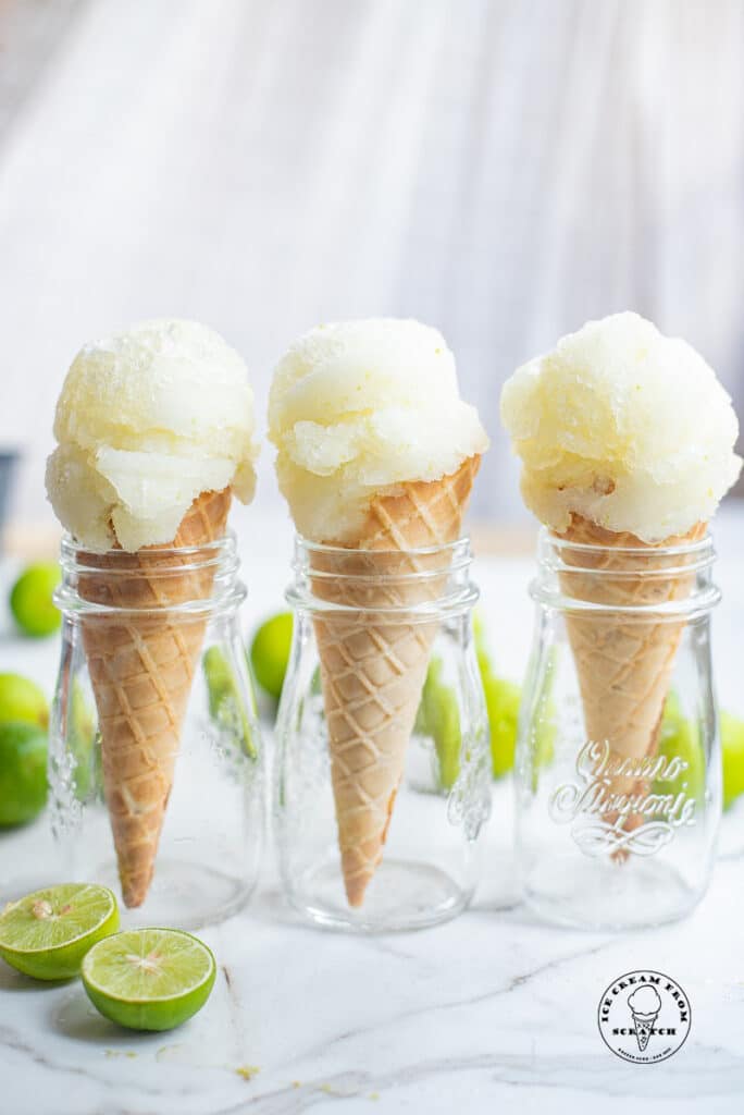 three ice cream cones with a scoop of lime sorbet