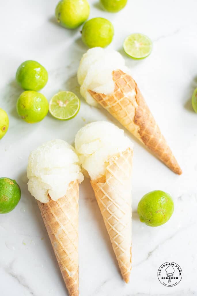 three ice cream cones with scoops of lime sorbet in each