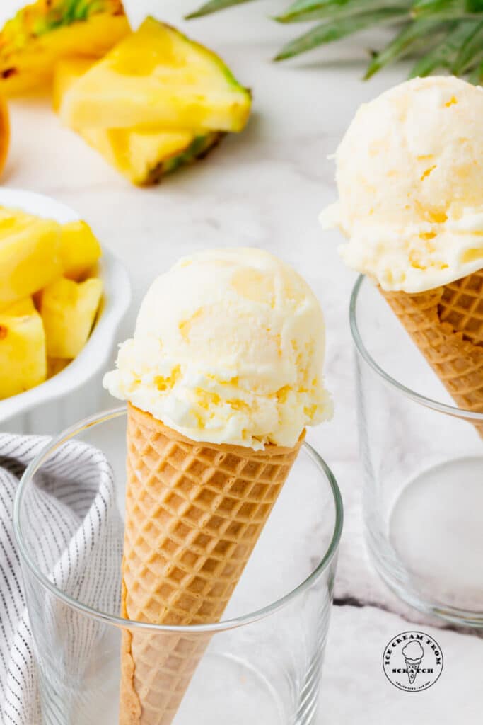 Pineapple ice cream in a cone