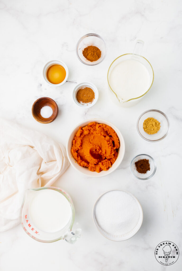 top down view of all of the ingredients needed to make pumpkin spice ice cream from scratch