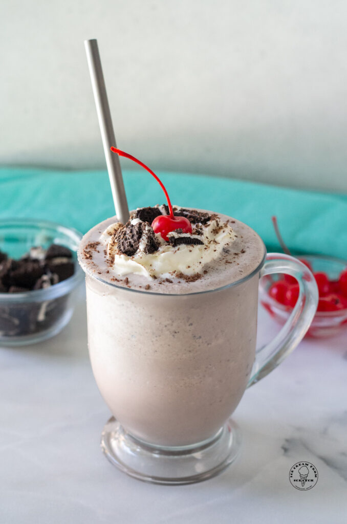 cookies and cream milkshake with a metal straw