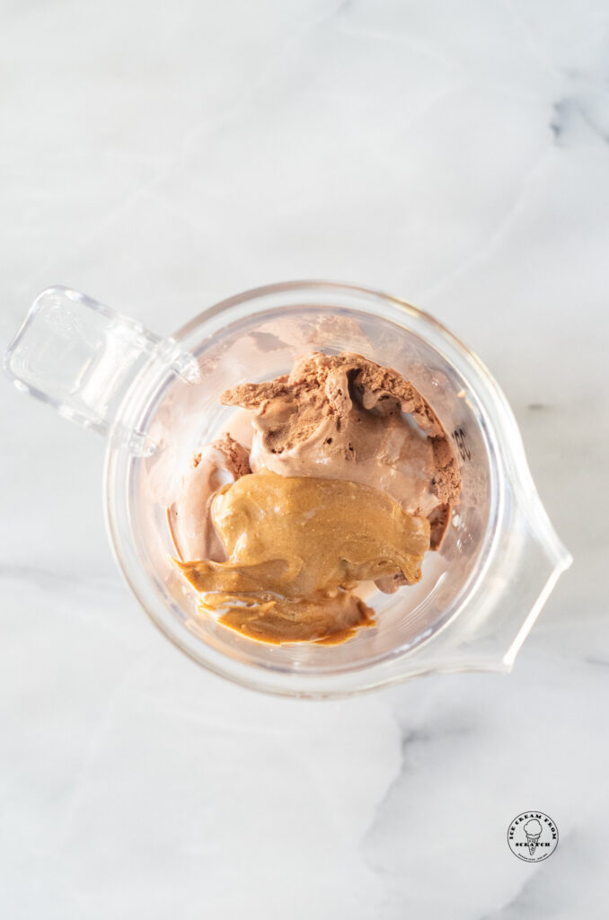peanut butter and chocolate ice cream in a blender jar