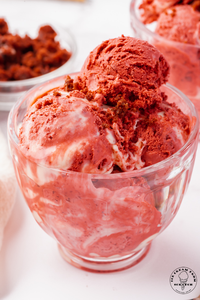 a glass bowl filled with red velvet ice cream.