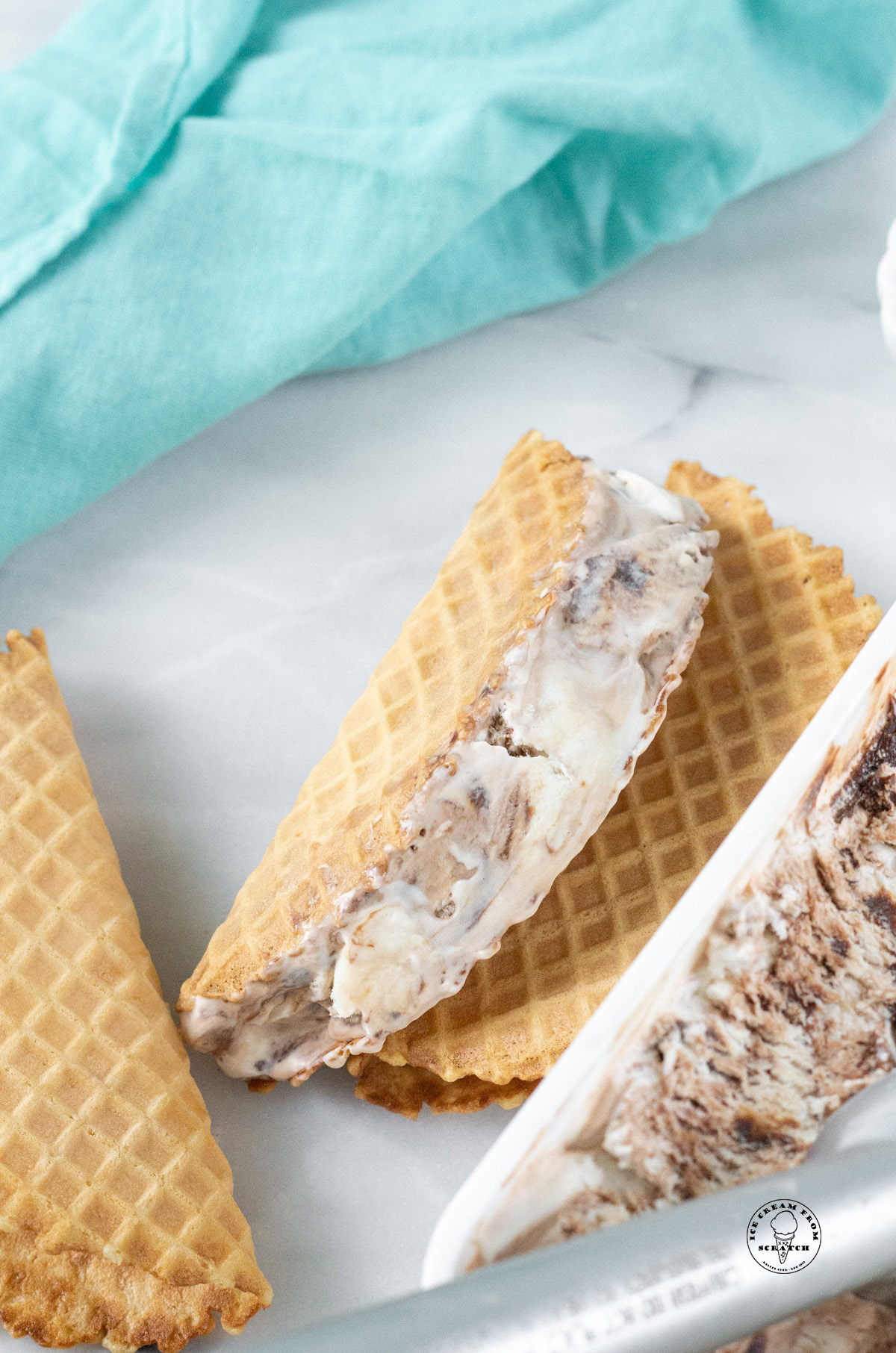 a waffle cone shell with ice cream in it showing how to make choco tacos