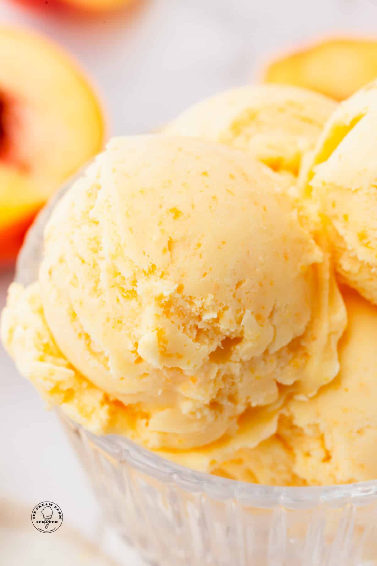 closeup view of a scoop of peaches and cream ice cream.