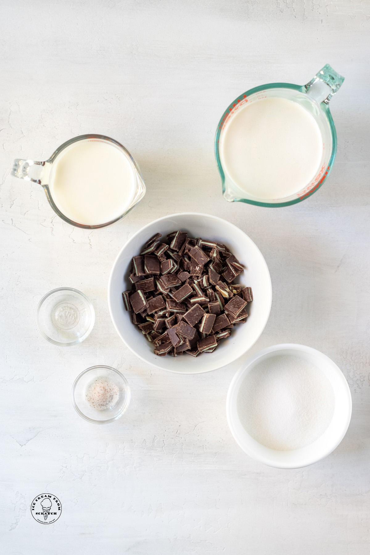 The ingredients needed to make andes ice cream recipe, including chopped chocolates, milk, and cream.