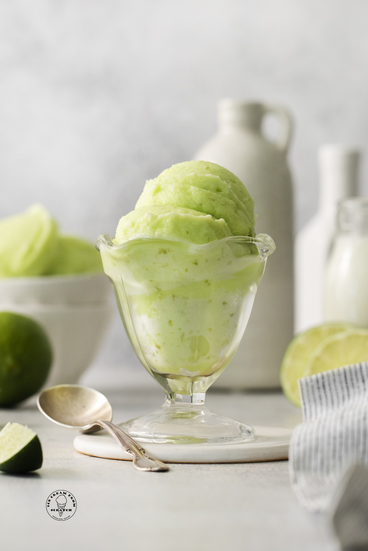 creamy lime sherbet in a footed glass dessert dish.