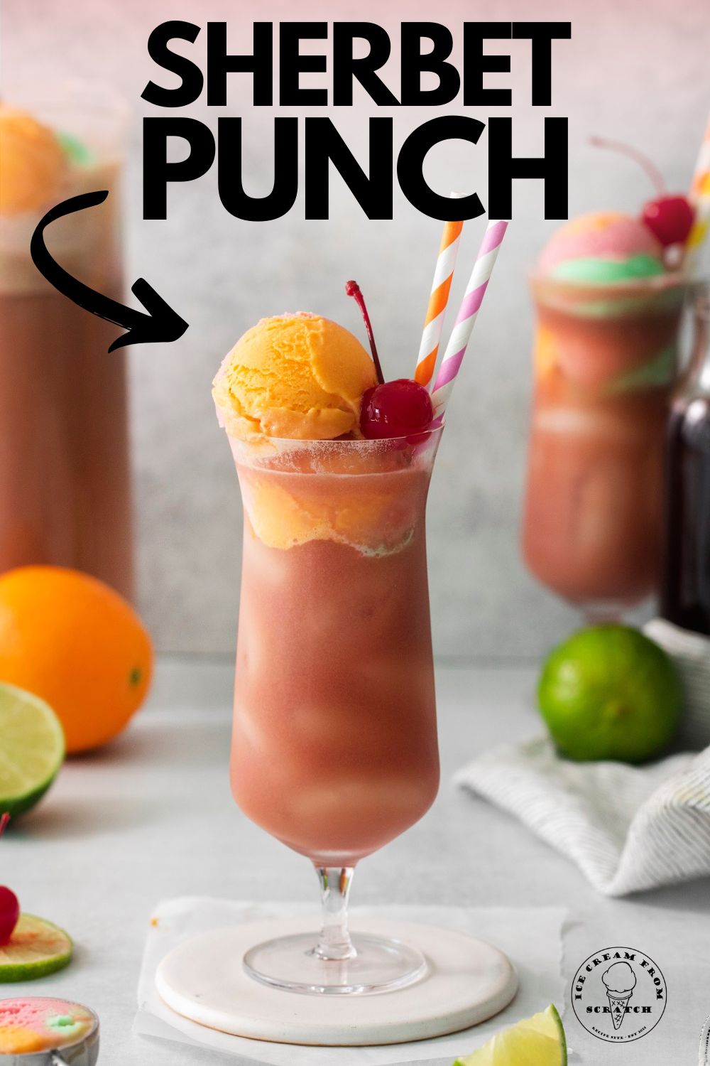a tall footed glass of sherbet punch with scoops of orange sherbet on top along with a maraschino cherry. Text overlay at top of image says "sherbet punch" with an arrow pointing at the glass.