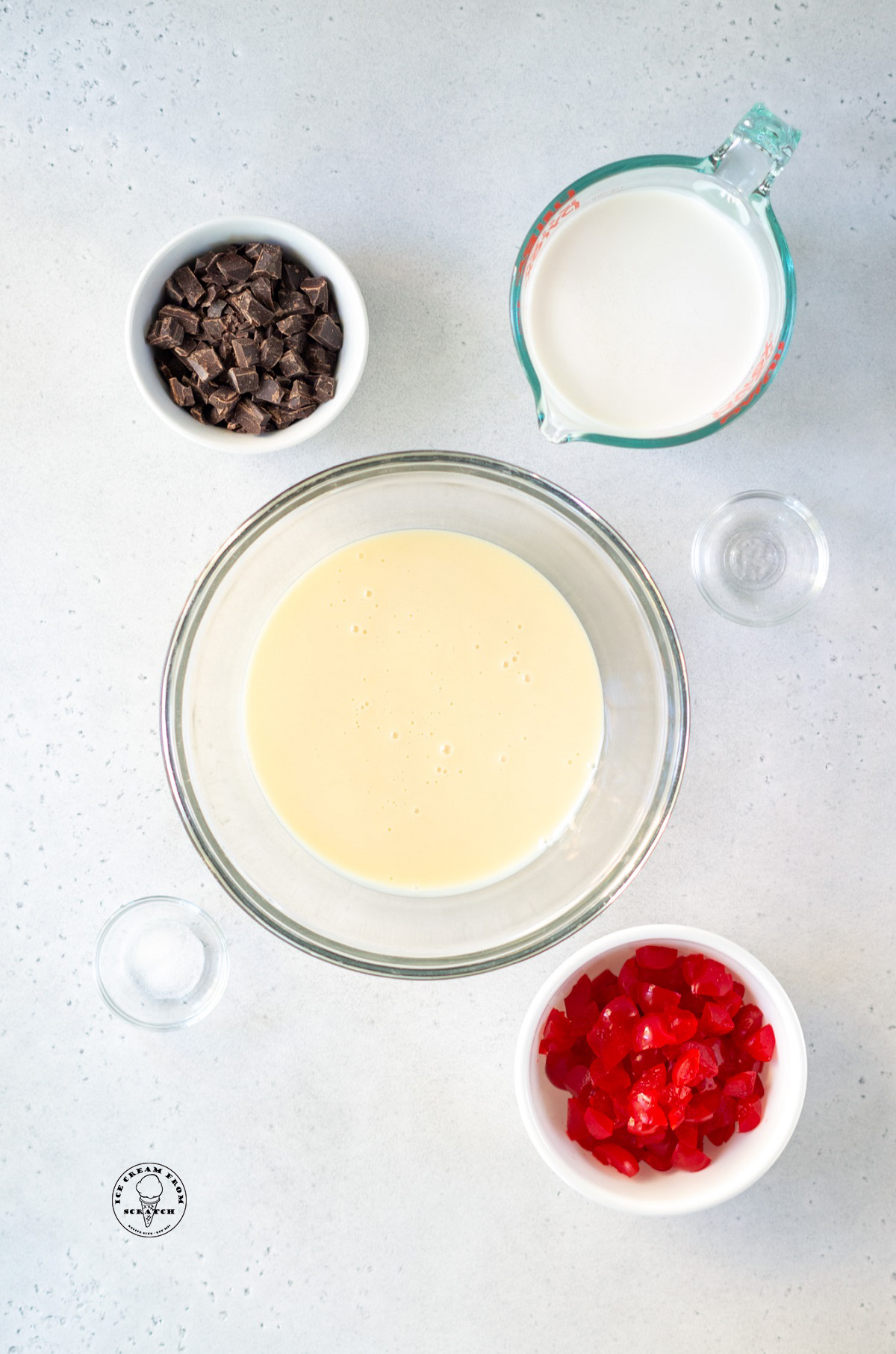 The ingredients needed to make no churn cherry ice cream with chocolate and sweetened condensed milk.