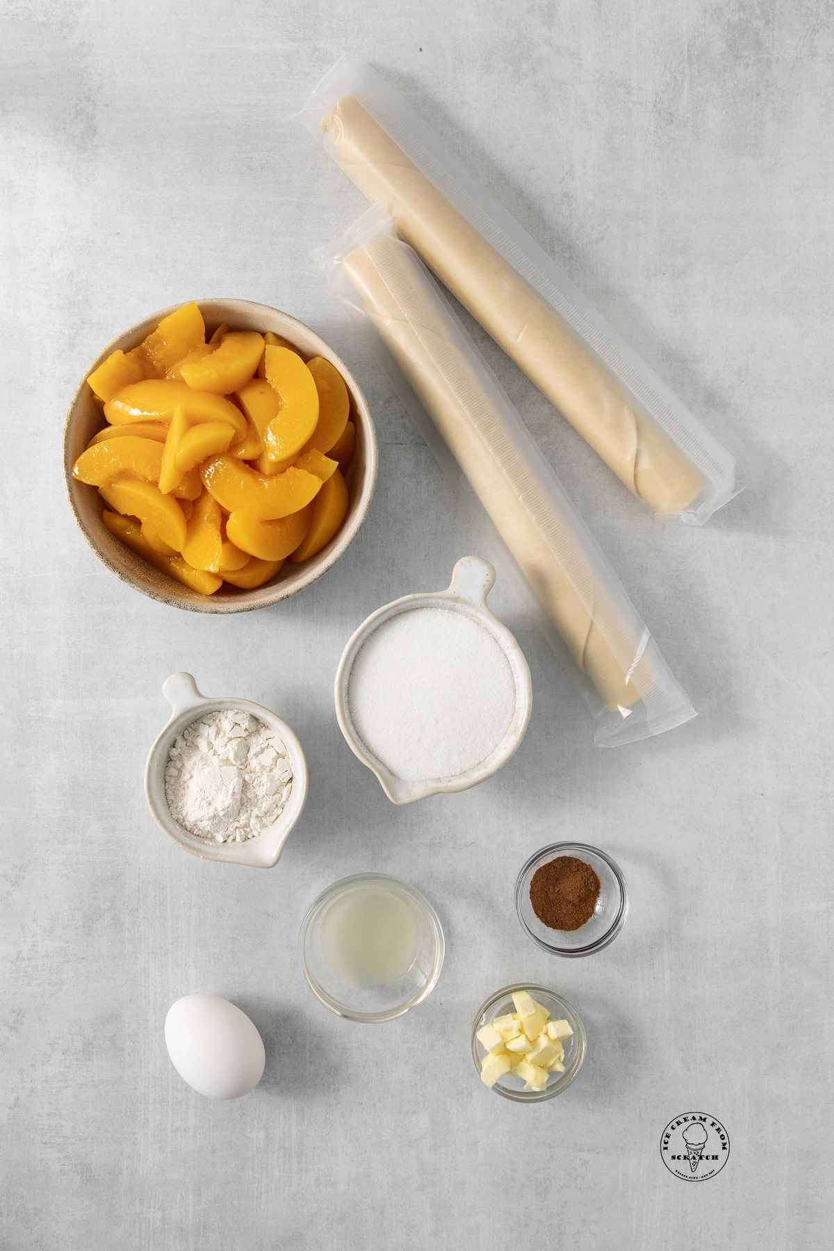 The ingredients needed to make an easy peach pie with canned peaches and refrigerated dough.