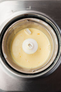 custard ice cream mixture in a ice cream machine mixing bowl