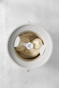 earl grey ice cream mixture in a ice cream maker bowl