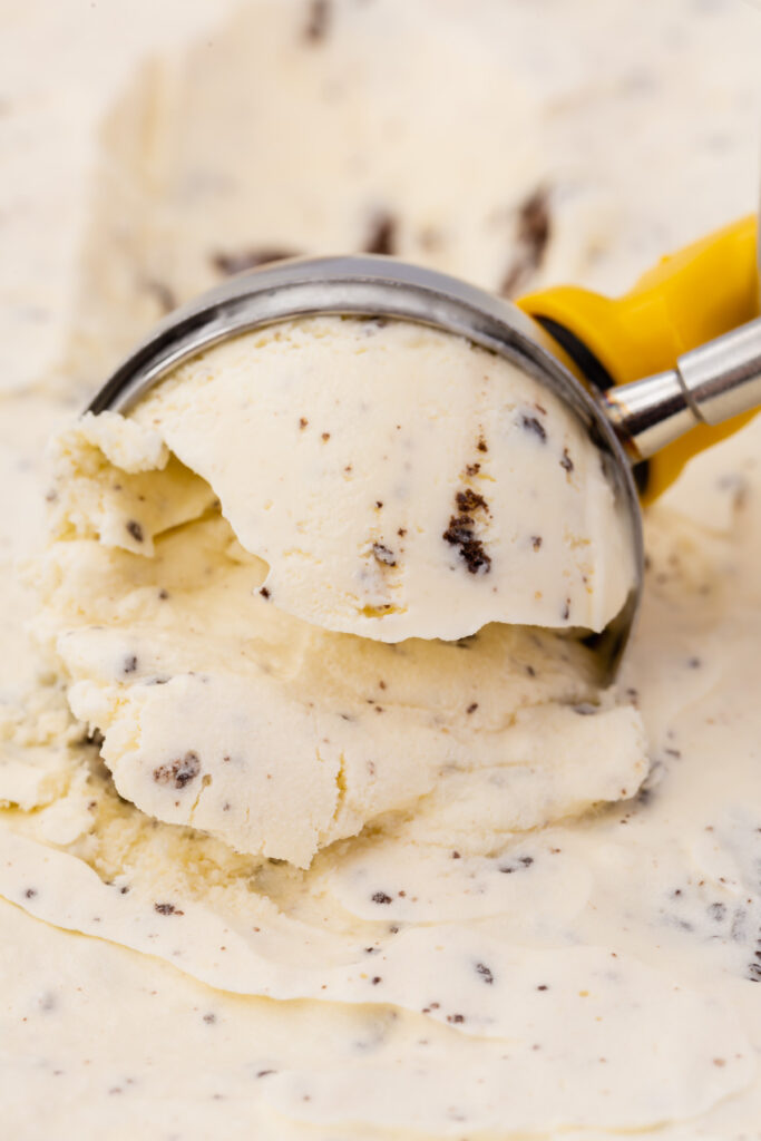 ice cream scoop dipped into cookies and cream ice cream