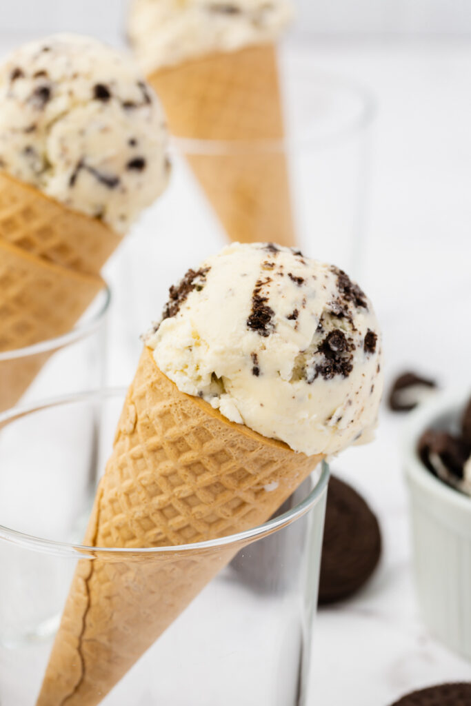 one scoop of cookies and cream ice cream on a cone