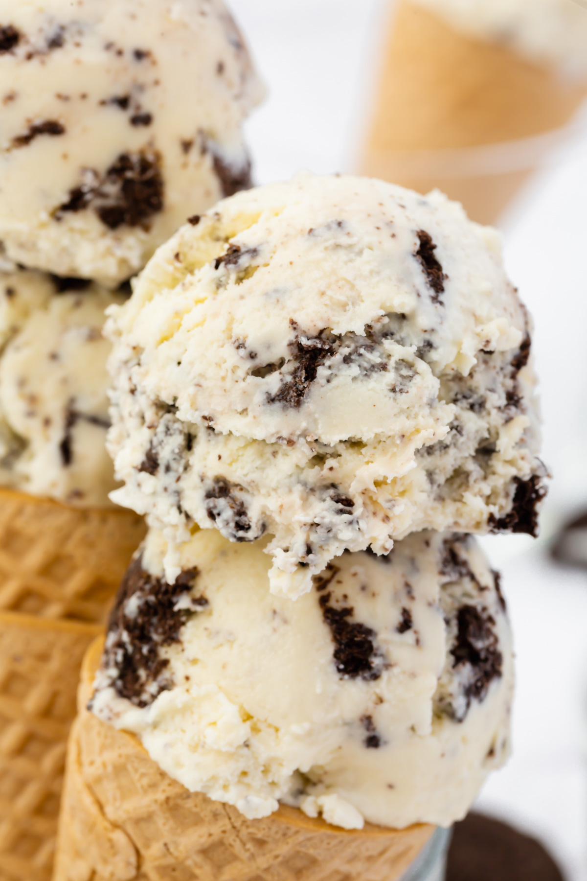 two scoops of cookies and cream ice cream on a cone